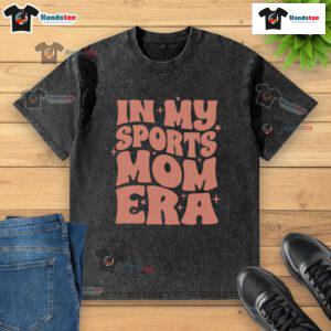 Alt Text: Woman wearing a 'Nice In My Sports Mom Era' washed t-shirt, showcasing casual style and sporty vibe.