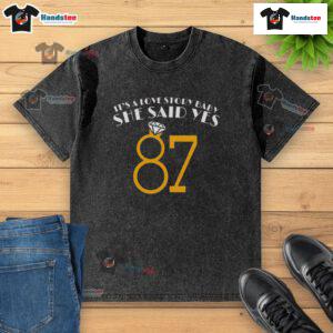 87 Washed T-Shirt featuring 'Nice, It's A Love Story, Baby, She Said Yes' design, perfect for romantic casual wear.