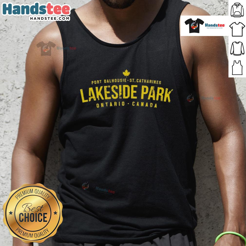 Person wearing a tank top at Nice Port Dalhousie Lakeside Park, St. Catharines, Ontario, Canada with scenic lake views.