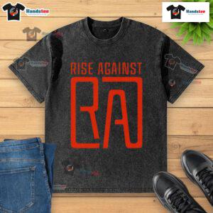 Nice Rise Against RA logo washed t-shirt displayed on a wooden surface, showcasing a trendy, casual style.