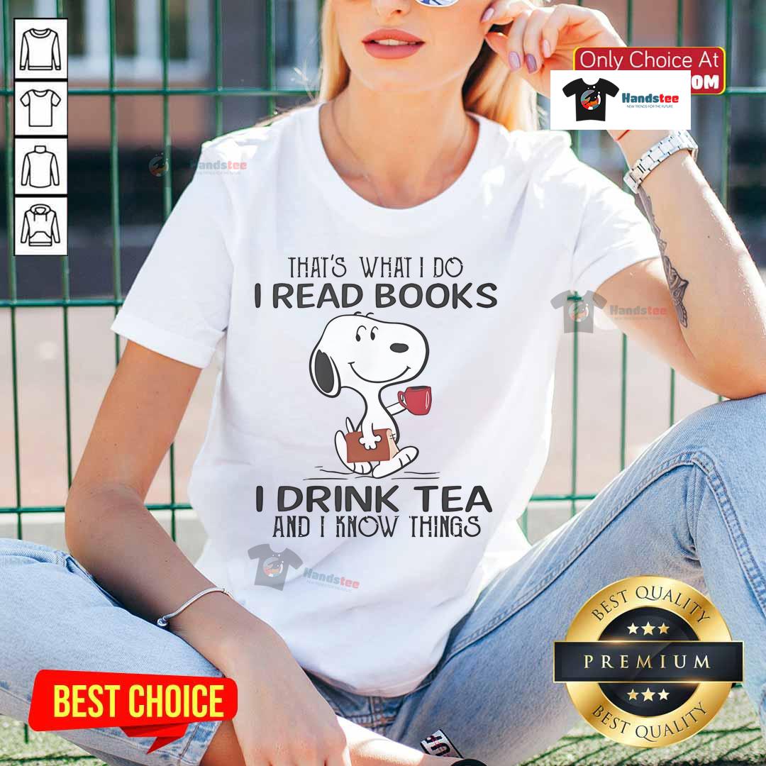 Alt Text: Snoopy graphic tee featuring the phrase 'I read books, I drink tea, and I know things' for ladies