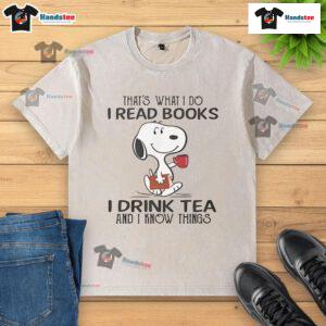Nice Snoopy t-shirt featuring 'I read books, I drink tea, and I know things' design for book lovers and tea enthusiasts.