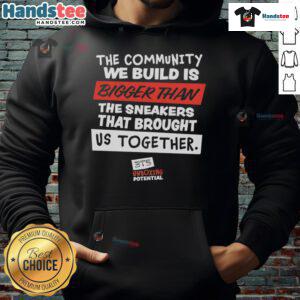 Nice hoodie featuring 'The Community We Build Is Bigger Than Us' slogan, perfect for showcasing unity and togetherness.