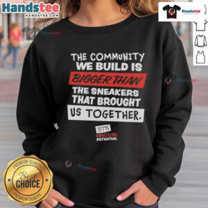 Nice sweatshirt featuring 'The Community We Build Is Bigger Than Us' design, promoting unity and togetherness.