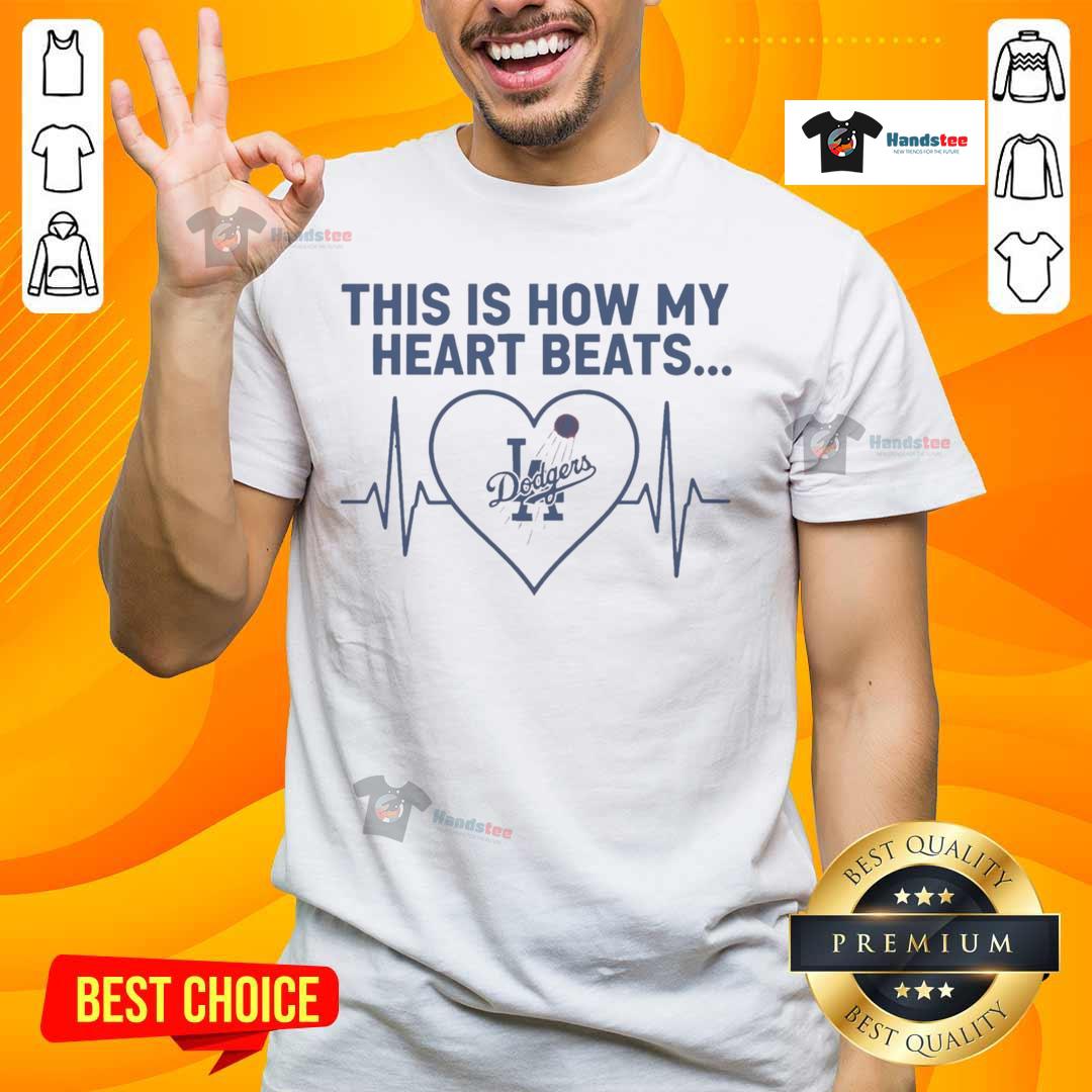 Alt Text: Stylish Los Angeles Dodgers T-shirt featuring 'Nice This Is How My Heart Beats' graphic design for fans.