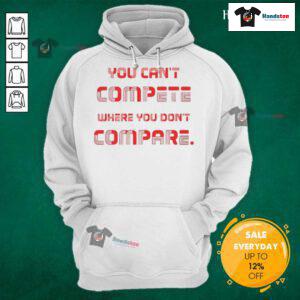 Stylish 'You Can't Compete Where You Don't Compare' hoodie in black, perfect for casual wear and motivational fashion.