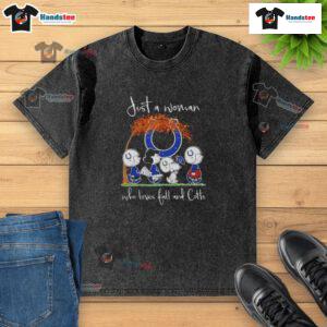 Woman in a washed t-shirt celebrating fall and Indianapolis Colts football, surrounded by autumn leaves.