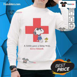 American Red Cross Peanuts Snoopy sweatshirt with 'A Little Goes A Long Way' slogan promoting blood donation.