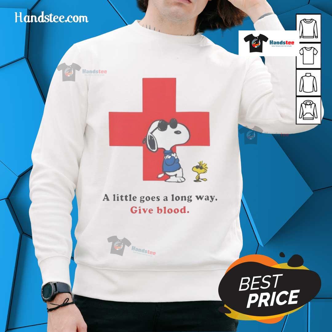 American Red Cross Peanuts Snoopy sweatshirt with 'A Little Goes A Long Way' slogan promoting blood donation.