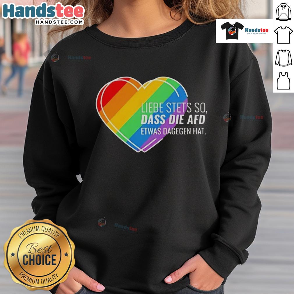Alt Text: Pride heart sweatshirt with 'Nice Liebe Stets So' design, showcasing support against AfD sentiments.