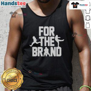 Alt Text: Official Cleveland Browns For The Brand tank top featuring team colors and logo, perfect for fans.