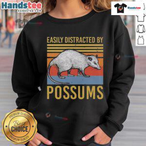 Alt Text: Vintage sunset sweatshirt featuring the phrase Easily Distracted by Possums with a playful animal design.