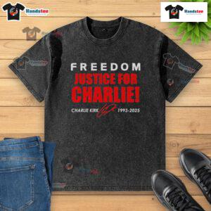 Red tribute washed t-shirt featuring 'Freedom & Justice for Charlie Kirk 1993-2025' signature design.