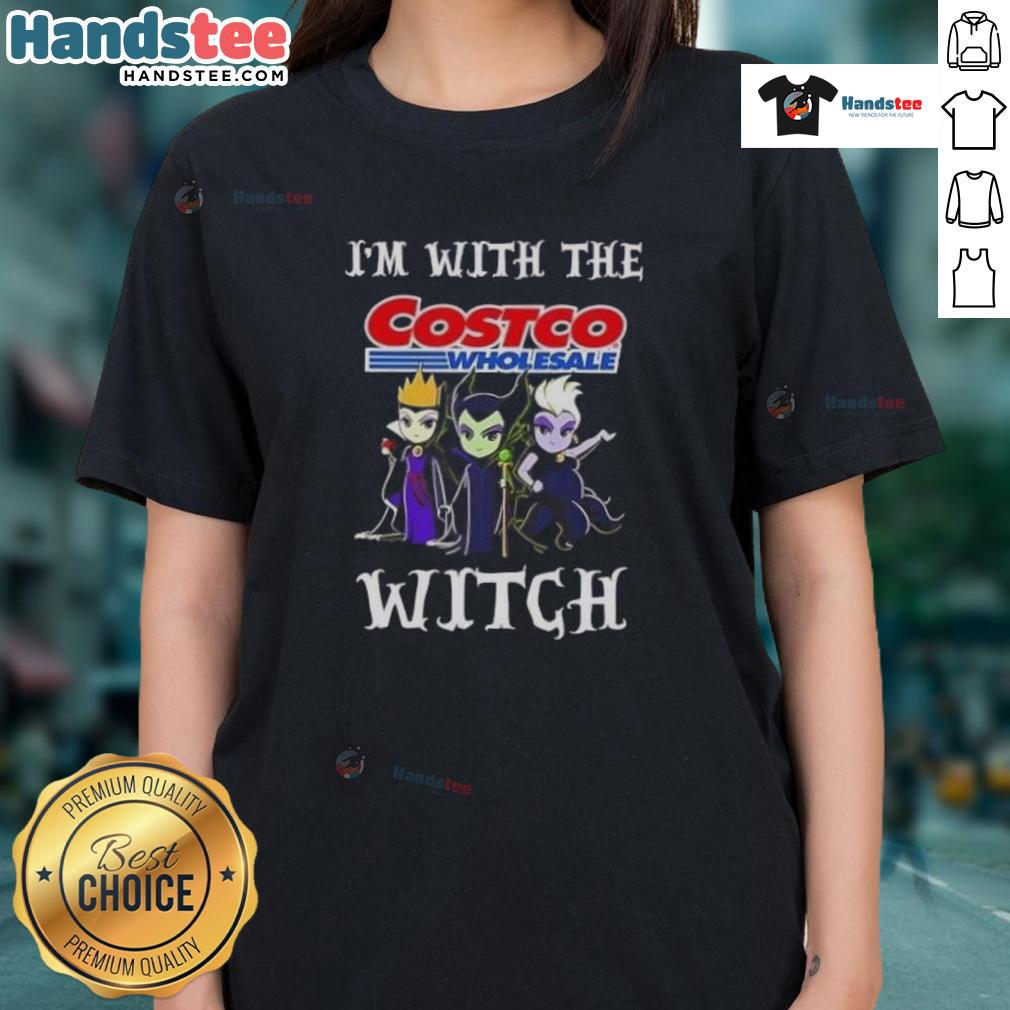 Official 'I'm With The Costco Wholesale Witch' Halloween ladies tee with playful witch graphic for festive fun.