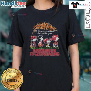 Official Peanuts characters and Arkansas Razorbacks NFL graphic on a ladies tee for the holiday season.
