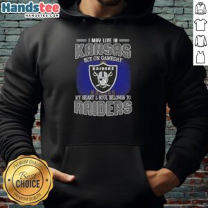 Fan wearing a Raiders hoodie, showcasing pride with the slogan 'I May Live In Kansas, But My Heart Belongs To Raiders.'