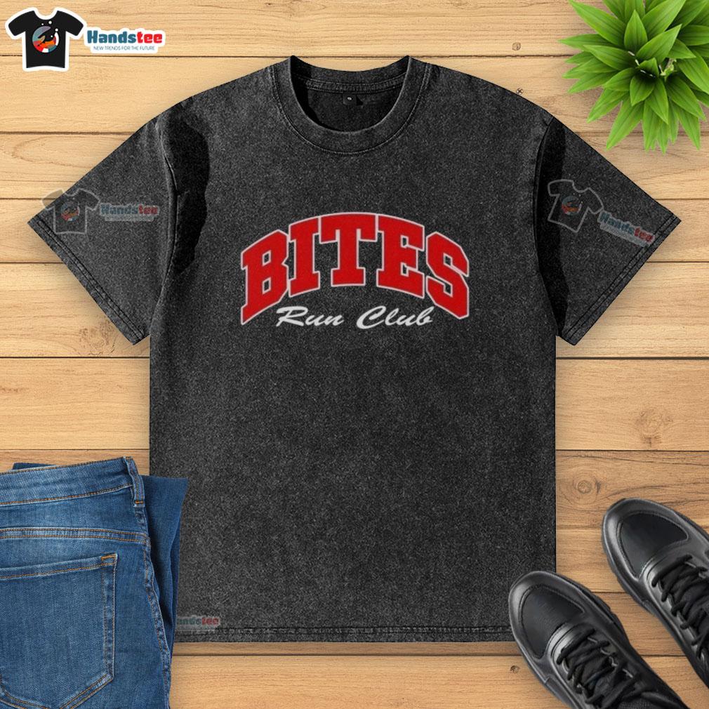 Good Bites Run Club Volume 2 washed t-shirt displayed on a wooden surface, showcasing its casual style and comfort.