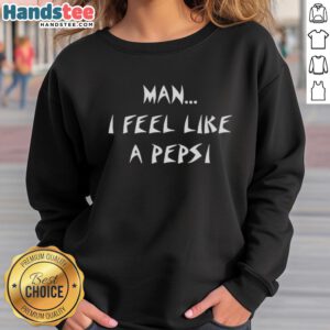 Alt Text: Man wearing a 'I Feel Like A Pepsi' sweatshirt, smiling joyfully in a casual setting, showcasing vibrant street style.