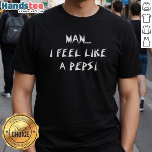 Happy man wearing a 'I Feel Like A Pepsi' t-shirt, smiling outdoors with a vibrant background, showcasing fun fashion.