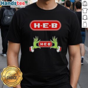 Nice Grinch hands holding a heart on an H-E-B Christmas T-shirt, perfect for holiday cheer and festive spirit.