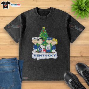 Alt Text: Premium Snoopy and Fiends Kentucky Wildcats Christmas washed t-shirt featuring festive graphics and vibrant colors.