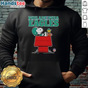 Alt Text: Snoopy in a Philadelphia Eagles hoodie, relaxing with a football in Peanuts style, perfect for Eagles fans.