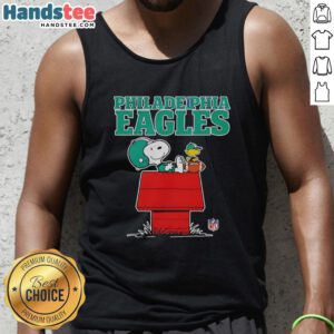 Snoopy chilling with a football in a Philadelphia Eagles tank top, Peanuts style, perfect for fans.
