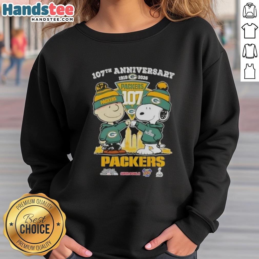 Alt Text: Cute Charlie Brown and Snoopy sweatshirt celebrating 107th anniversary with Green Bay Packers football skyline design.