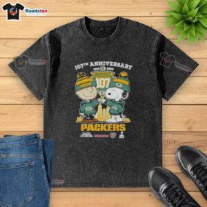Alt Text: Cute Charlie Brown and Snoopy 107th Anniversary T-Shirt featuring Green Bay Packers football skyline design.