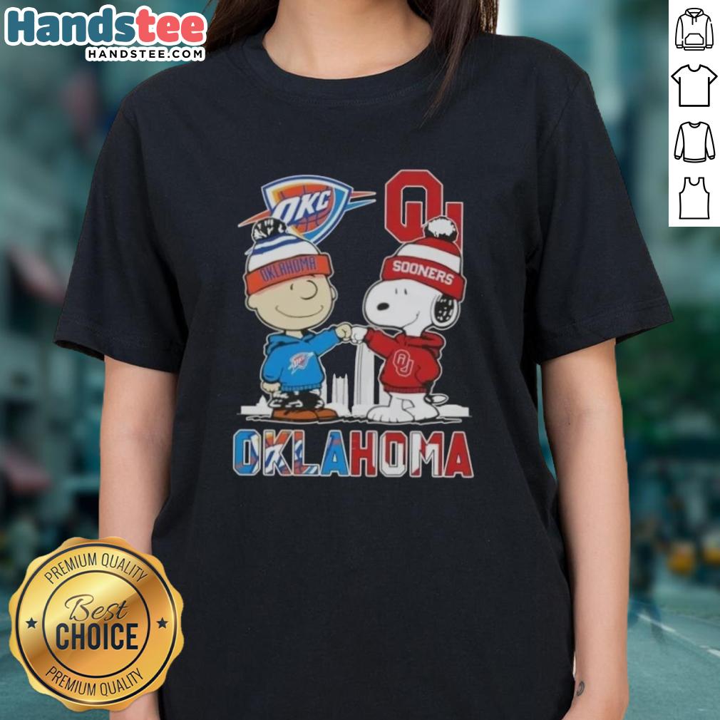 Alt Text: Cute Charlie Brown and Snoopy graphic on Oklahoma City Sports Thunder x Sooners ladies tee shirt.
