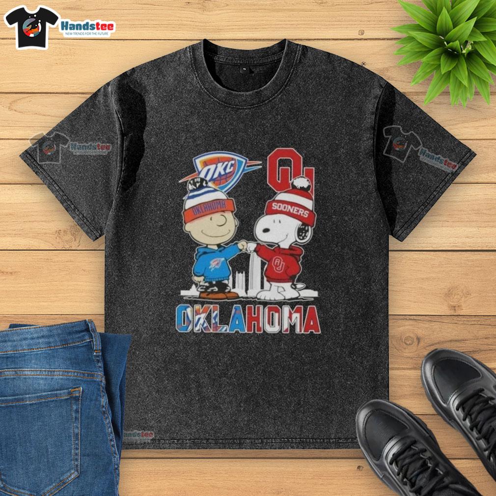 Alt Text: Cute Charlie Brown and Snoopy on an Oklahoma City Skyline washed t-shirt featuring Thunder and Sooners logos.