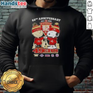 Alt Text: Cute Charlie Brown and Snoopy hoodie celebrating Super Bowl 82nd Anniversary with San Francisco 49ers skyline design.
