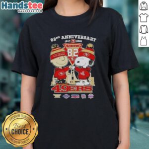 Alt Text: Cute Charlie Brown and Snoopy celebrate Super Bowl 82nd Anniversary 1944-2026 with 49ers football skyline ladies tee.