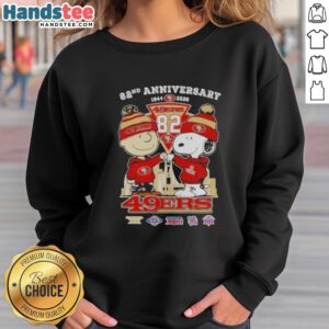 Alt Text: Cute Charlie Brown and Snoopy on a sweatshirt celebrating the 82nd Super Bowl, featuring 49ers skyline design.