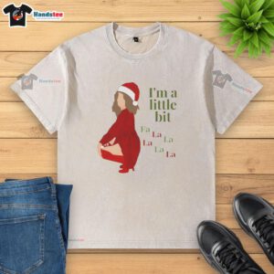 Funny I'm A Little Bit Fa La Christmas washed t-shirt featuring festive graphics, perfect for holiday celebrations.