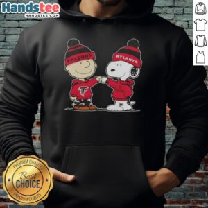 Alt Text: Charlie Brown and Snoopy fist bump in Atlanta Falcons hoodie, showcasing Good Peanuts collaboration and football spirit.