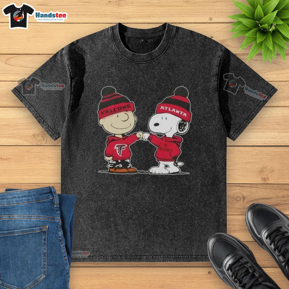 Charlie Brown and Snoopy fist bump on a washed T-shirt featuring Atlanta Falcons logo, celebrating good vibes and football.