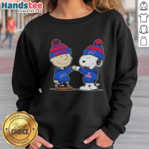 Charlie Brown and Snoopy fist bump in a Buffalo Bills football sweatshirt, celebrating friendship and team spirit.