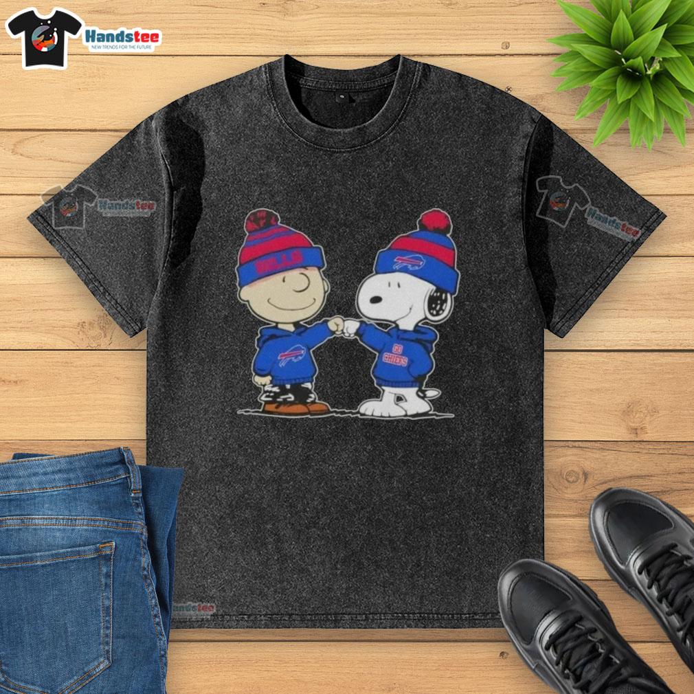 Charlie Brown fist bumps Snoopy in a Buffalo Bills football washed t-shirt, celebrating friendship and sports spirit.
