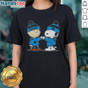 Charlie Brown and Snoopy fist bump in Carolina Panthers football ladies tee, celebrating friendship and team spirit.