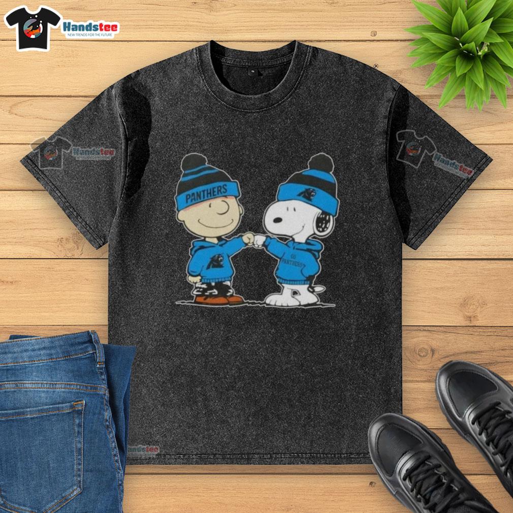 Good Peanuts Charlie Brown fist bump with Snoopy, featuring Carolina Panthers football design on a washed T-shirt.