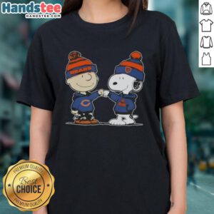 Good Peanuts Charlie Brown fist bump with Snoopy, featuring Chicago Bears football design on a ladies tee.