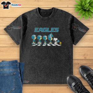Good Philadelphia Eagles X Peanuts Snoopy and Friends Abbey Road washed t-shirt featuring iconic characters and team spirit.
