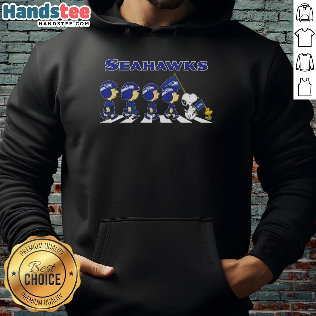 Alt Text: Good Seattle Seahawks X Peanuts Snoopy and Friends Abbey Road Hoodie featuring fun cartoon characters and team colors.