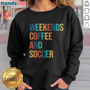 Cozy 'Good Weekends Coffee and Soccer' sweatshirt displayed on a wooden table, perfect for casual outings or relaxing at home.