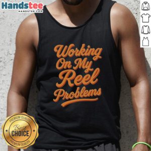 Happy person wearing a fishing tank top, working on reel problems with a smile, showcasing a love for fishing.