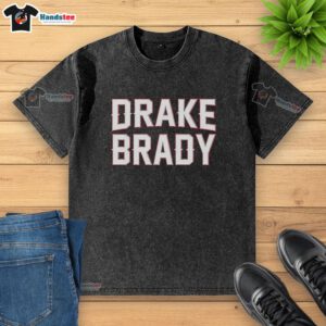 Hot Drake Maye in a stylish washed t-shirt with Tom Brady graphic, showcasing trendy sportswear fashion.