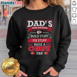 Alt Text: Dad in Kansas City Chiefs sweatshirt builds and fixes things, showcasing his job duties and team pride.