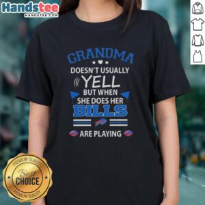 Nice grandma in a Buffalo Bills football tee, smiling and cheering during the game, showcasing her team spirit.