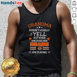 Nice grandma wearing a Chicago Bears tank top, excitedly cheering during a football game.